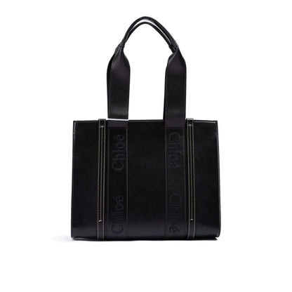 Chloé Black Woody Embroidered Logo Leather Medium Tote Bag with black embroidered logo and dual handles, made of premium leather.