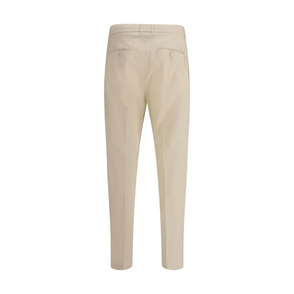 Back view of Cruna Beige Cotton Casual Pants with buttoned welt pockets and elastic waistband.