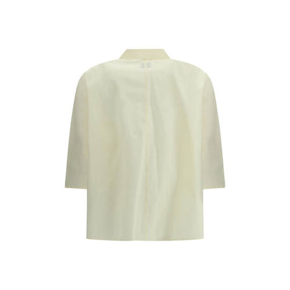 Back view of Cruna Yellow Cotton Blouse with 3/4 sleeves and classic collar, elegant for casual or formal occasions.