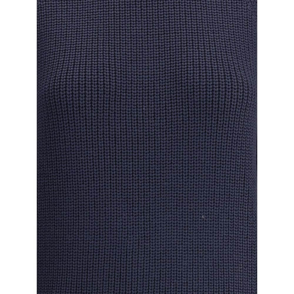 Close-up of the chunky knit fabric of Ella Blue Merino Wool Sweater, showcasing its texture and deep blue color.