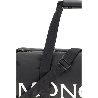 Moncler Black Nylon Luggage And Travel duffle bag with adjustable strap and logo close-up.