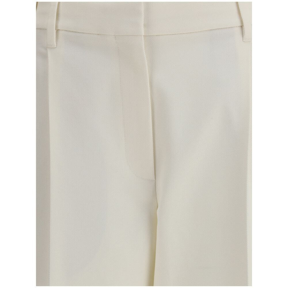 Close-up of Brunello Cucinelli White Cotton Chino Pants showcasing tailored pleats and cropped ankle length design.