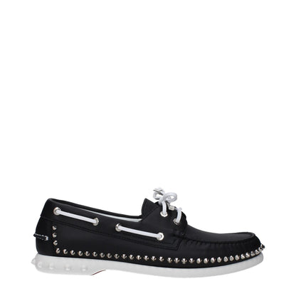 Christian Louboutin Black Leather Slip-On Loafers with studs and rubber sole, lace-up closure, low flat heel, and round toe design.