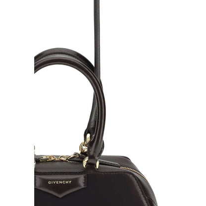 Close-up of Givenchy Brown Calf Leather Bos Taurus Handbag featuring embossed logo and gold finish details.