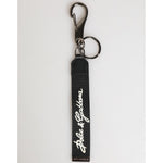 Dolce & Gabbana Black White Polyester DG Logo Silver Men Keychain Keyring with strap and metal hardware on white background