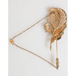 Dolce & Gabbana Gold Tone Leaf 925 Sterling Silver Crystal Chain Brooch with elegant design and sparkling crystals.