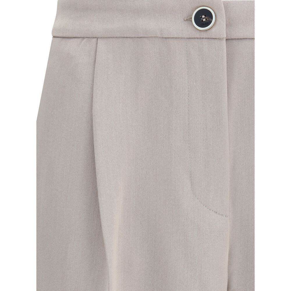 Close-up of Cruna Beige Polyester Casual Pants with button and pocket details, showing modern design and clean silhouette.
