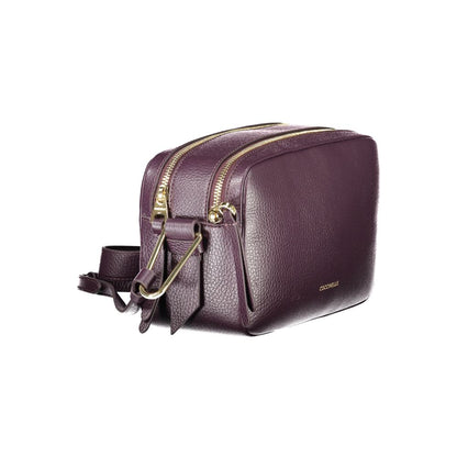 Coccinelle Purple Leather Women Handbag with adjustable shoulder strap and dual compartments, showcasing Italian sophistication.