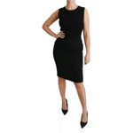 Woman wearing Dolce & Gabbana Black Lace Gown Bodycon Sheath STAFF Dress, sleeveless with zipper closure, showcasing elegant craftsmanship.