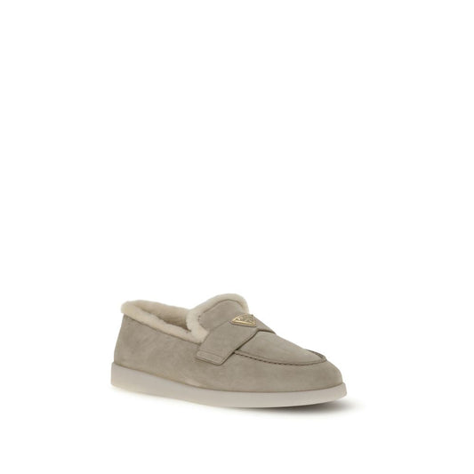 Prada Suede Loafers with fur lining, round toe, and triangular logo plaque, featuring rubber sole and calf leather upper, made in Italy.