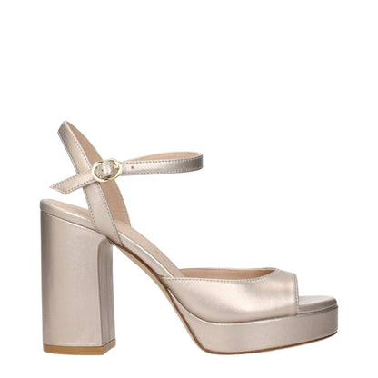 Stuart Weitzman Beige Leather Platform Sandals with metallic effect, side view showcasing elegant design and block heel.