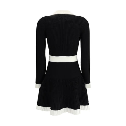 Balmain Black Viscose Casual Dress with flared skirt and embossed buttons, showcasing back view in black and white knit fabric.