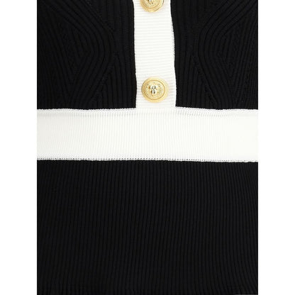 Close-up of Balmain Black Viscose Casual Dress featuring embossed buttons, ribbed trim, and structured knit detail.
