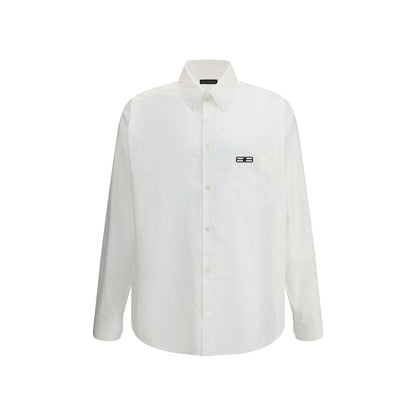 Balenciaga White Cotton Dress Shirt with embroidered logo and asymmetrical hem, featuring classic collar and front button closure, oversize fit.