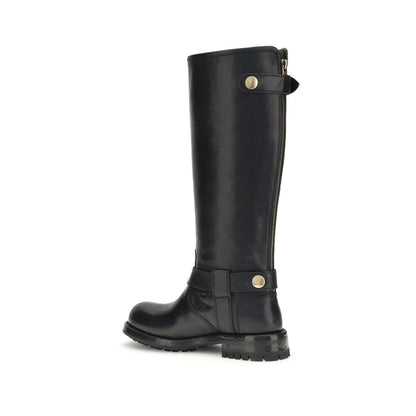 Dolce & Gabbana Black Calf Leather Bos Taurus Lace-Up Boots with matte gold buckle and durable leather insole, side view.