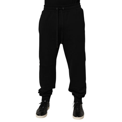 Dolce & Gabbana Black Cotton Drawstring Logo Sweatpants Pants with ribbed hems and adjustable waistband, featuring logo patch.