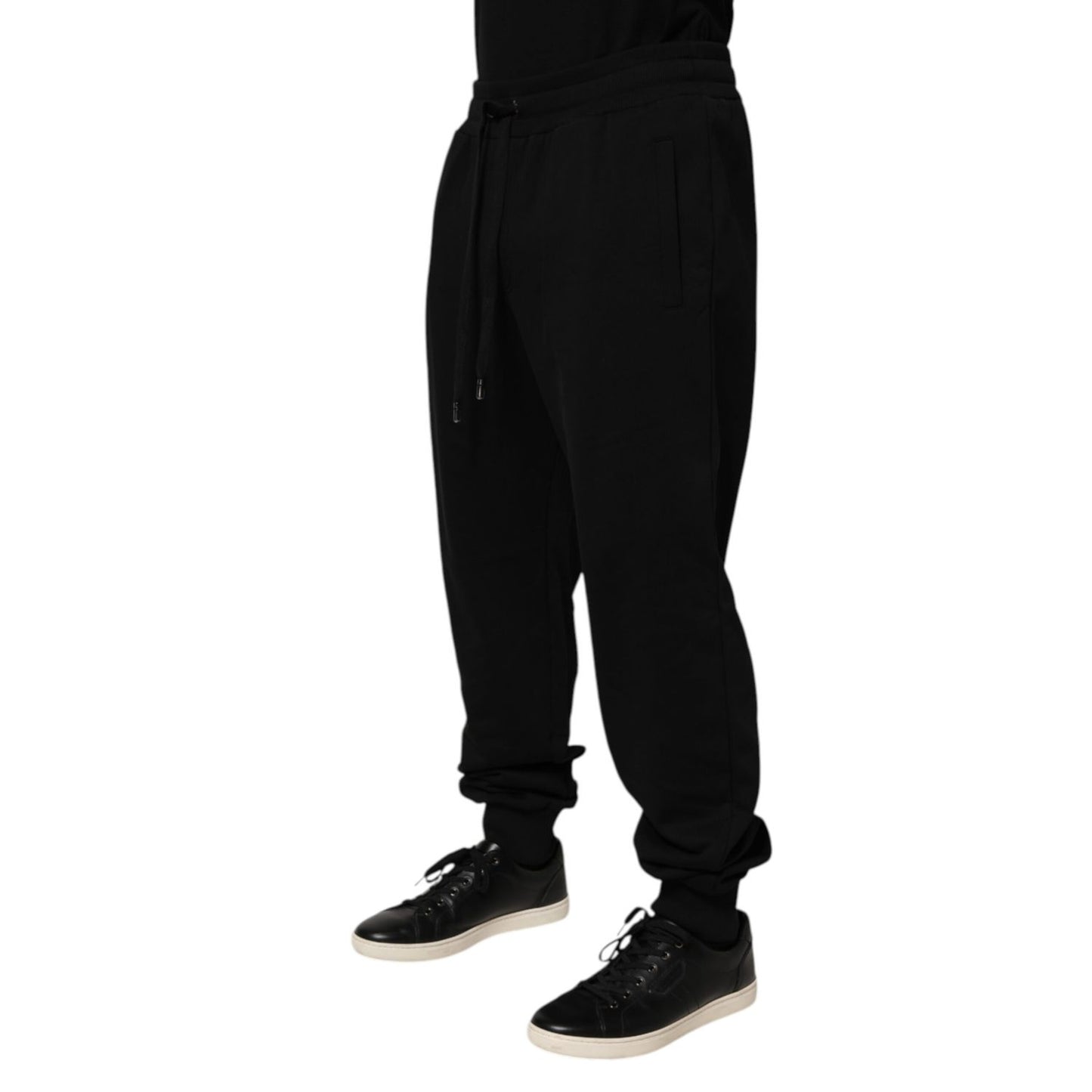 Dolce & Gabbana Black Cotton Drawstring Logo Sweatpants Pants for men with ribbed hems, adjustable drawstring, and logo patch.