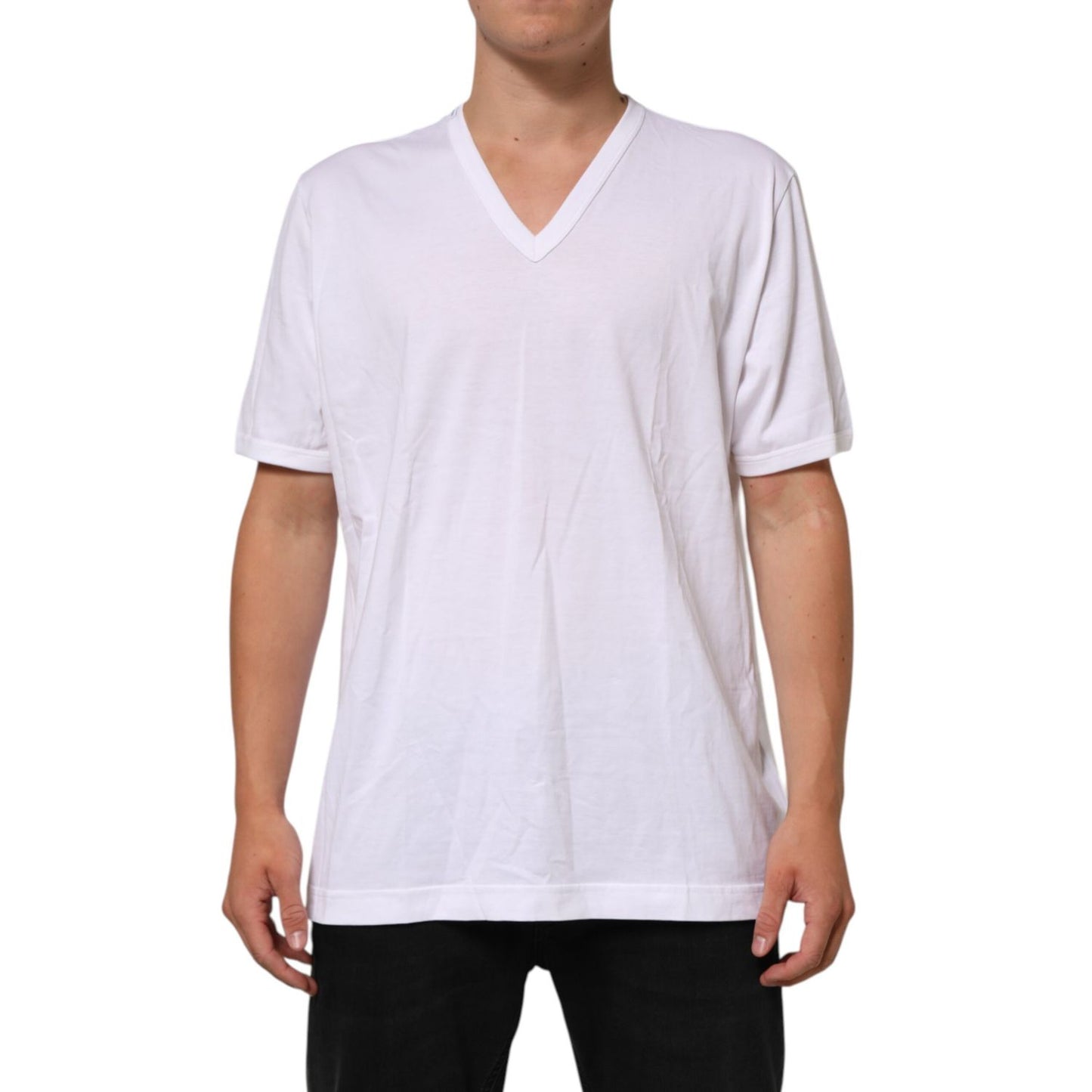 Man wearing Dolce & Gabbana White Cotton V-Neck Short Sleeves T-shirt, showcasing classic and versatile style in breathable cotton.
