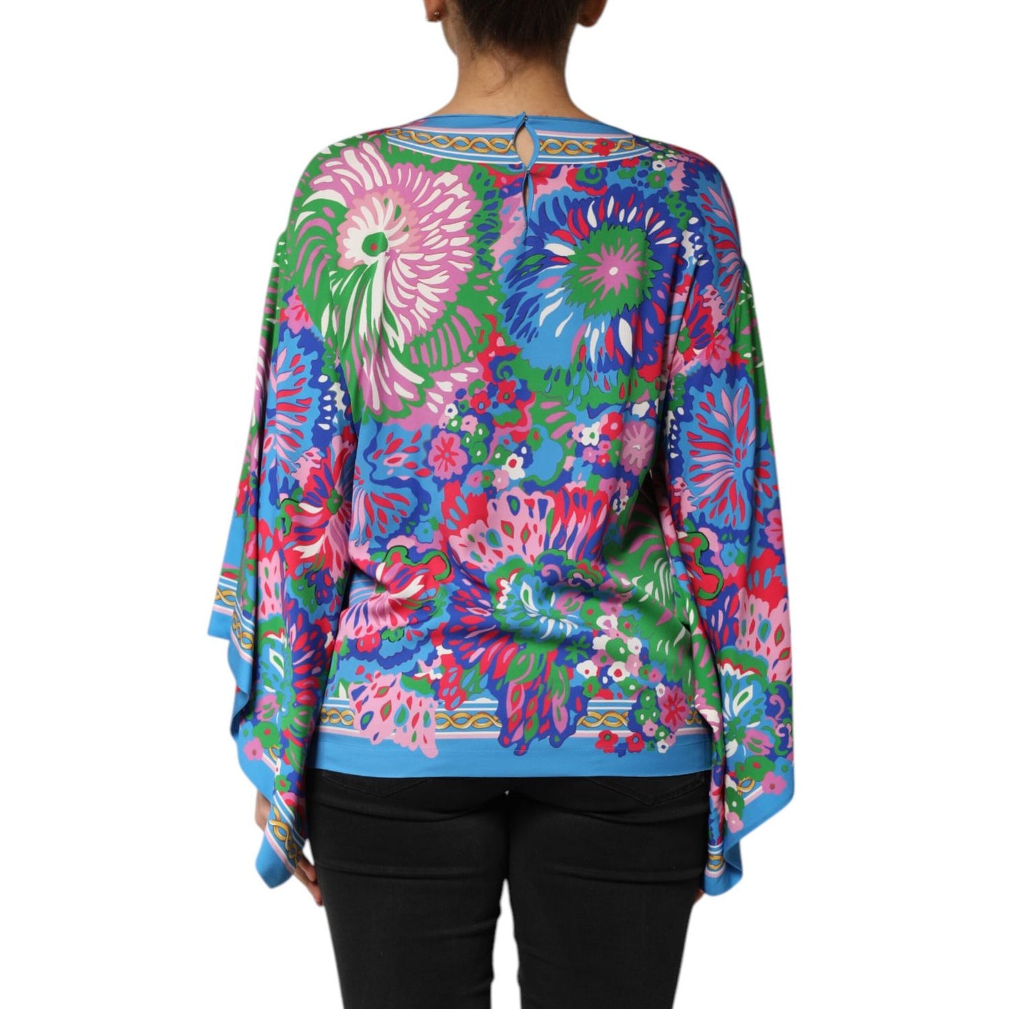 Woman wearing Dolce & Gabbana Multicolor Floral Print Silk Blouse Tunic Top, showcasing vibrant floral design.
