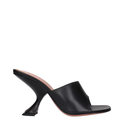 Amina Muaddi Black Leather Stiletto Heel Sandals with unique heel design, side view.