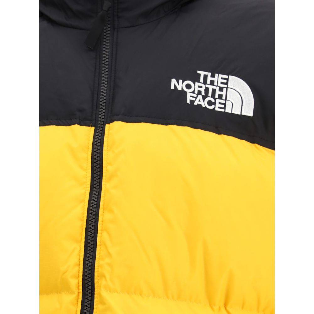The North Face Yellow Polyamide Shell Jacket with black contrast and logo, featuring zip closure, ideal for urban style and functionality.