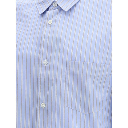 Close-up of Comme Des Garçons Light Blue Cotton Pattern Shirt with subtle stripes and button-up design.