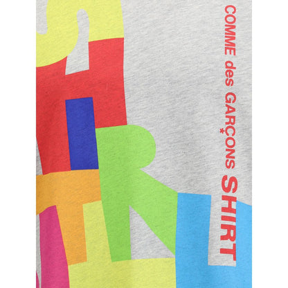 Comme Des Garçons Gray Cotton T-Shirt with colorful abstract print and logo on the front, featuring a minimalist design for AW25 season.