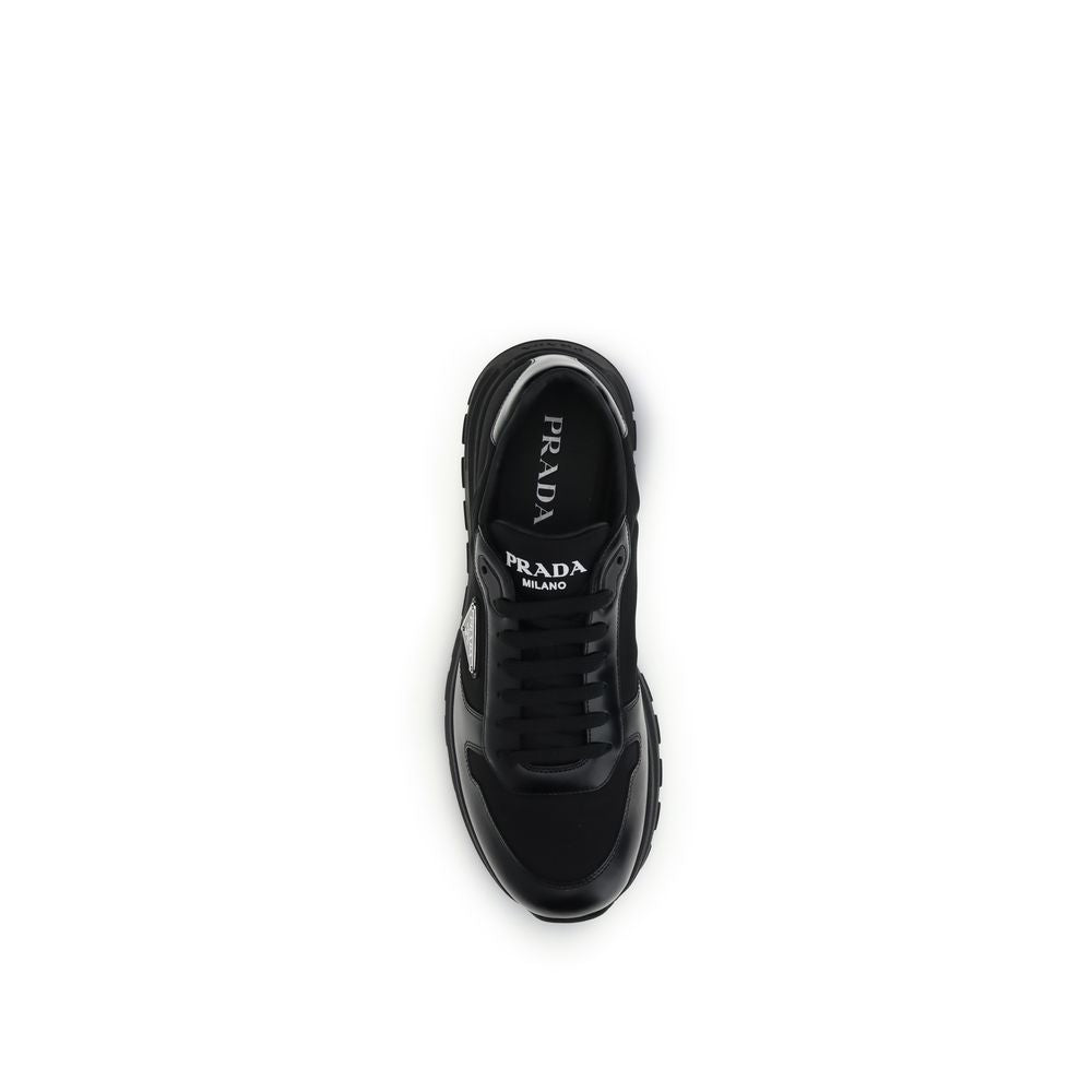 Top view of Prada Black Recycled Polyamide Athletic Sneakers showing enameled logo, laces, and Prada Milano lettering on the tongue.