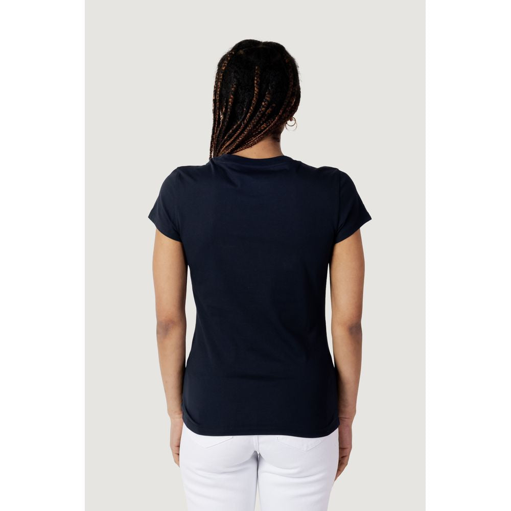 Back view of a woman wearing an Armani Exchange Blue Cotton T-Shirt, showcasing its fit and design.