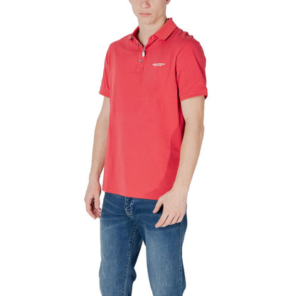 Man wearing Armani Exchange Red Cotton Polo Shirt with jeans, showcasing modern style and comfort.