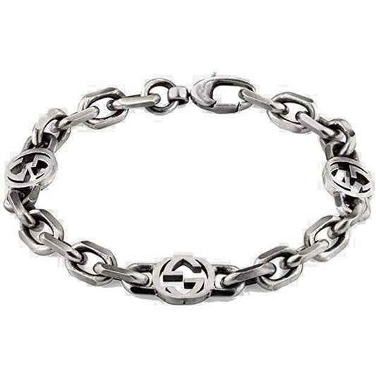 BRACCIALI GUCCI MOD. YBA620798001 silver link bracelet with iconic logos, showcasing luxury fashion design and craftsmanship.