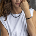 Woman wearing BREIL JEWELS Mod. TJ2938 bracelet, showcasing elegant design for ladies. Comes in official packaging box.