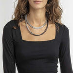 Lady wearing BREIL JEWELS Mod. TJ2938 bracelet, showcasing elegant design and style, packaged in official box.