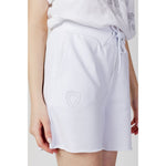 Woman wearing Blauer White Cotton Joggers Workout Pant with elastic waistband and side pockets, showcasing breathable comfort and style.