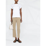 Model wearing Brunello Cucinelli Chain-trim round-neck t-shirt in white with short sleeves and chain-link detailing, styled with beige pants.