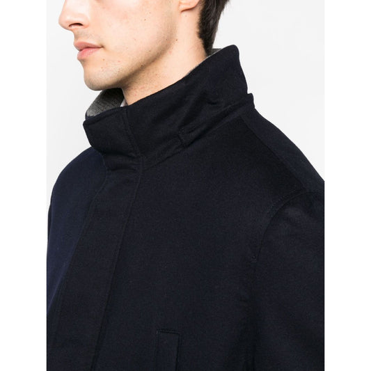 Brunello Cucinelli Detachable hood padded coat, midnight blue cashmere blend with stand-up collar, side view on model.