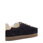 Brunello Cucinelli Suede sneakers in dark blue with leather detail, flat laces, round toe, and rubber sole.