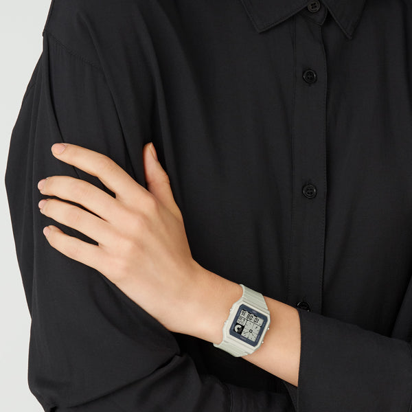 Unisex wrist wearing CASIO COLLECTION Mod. POP - GREY wristwatch with resin strap and multifunction dial in official packaging.