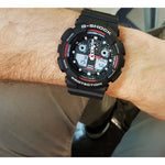 Men wearing black CASIO G-SHOCK Mod. GS BASIC quartz multifunction watch with resin strap, 20 ATM water resistance, mineral dial