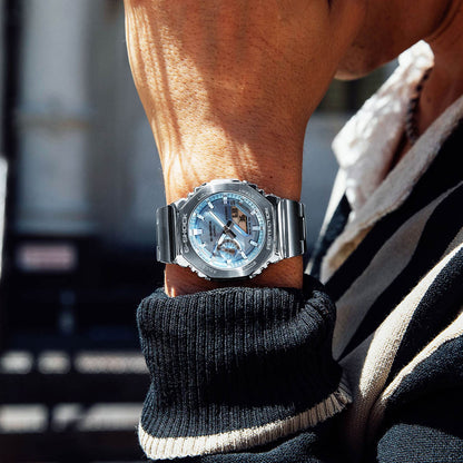 Person wearing CASIO MOD. GM-2110D-2AER watch on wrist outdoors