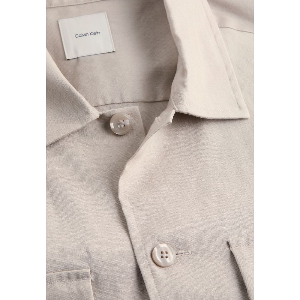 Close-up of Calvin Klein Beige Lyocell Jackets And Coat featuring button and collar details.