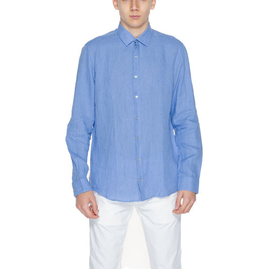 Man wearing Calvin Klein Blue Linen Dress Shirt with classic collar and button closure