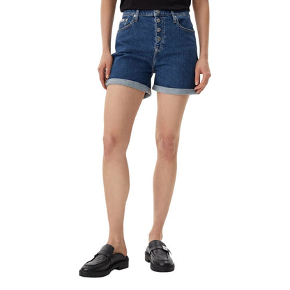 Woman wearing Calvin Klein Jeans Blue Cotton Shorts with high-waist design, button closure, and rolled hem, perfect for summer fashion.