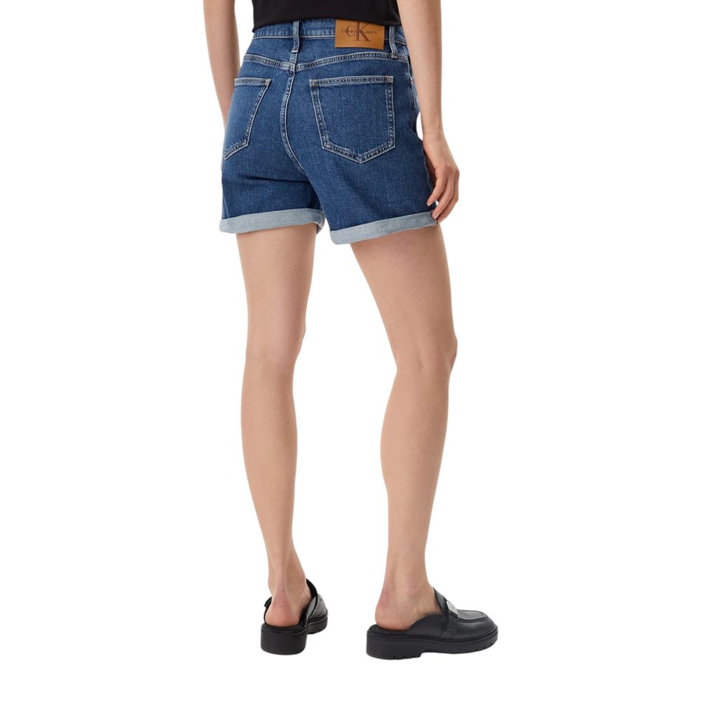 Rear view of Calvin Klein Jeans Blue Cotton Shorts worn by a model, featuring a high-waisted design and turned-up hems.