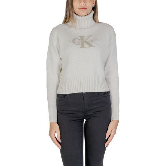 Calvin Klein Jeans Cream Cotton Sweater with CK logo and ribbed turtleneck, women's cropped fit, showcasing modern and refined style.