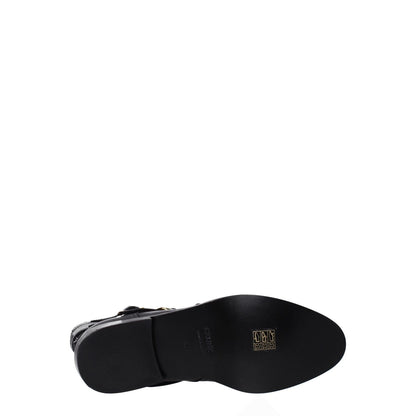 Celine Black Leather Flat Boots with pointy toe and low, flat heel showcasing gold details and vintage effect.