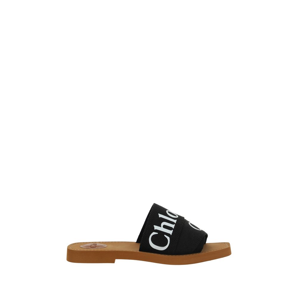 Chloé Black Rubber Sandals featuring flat sole, square toe, and iconic brand signature on double front bands, perfect for SS26.