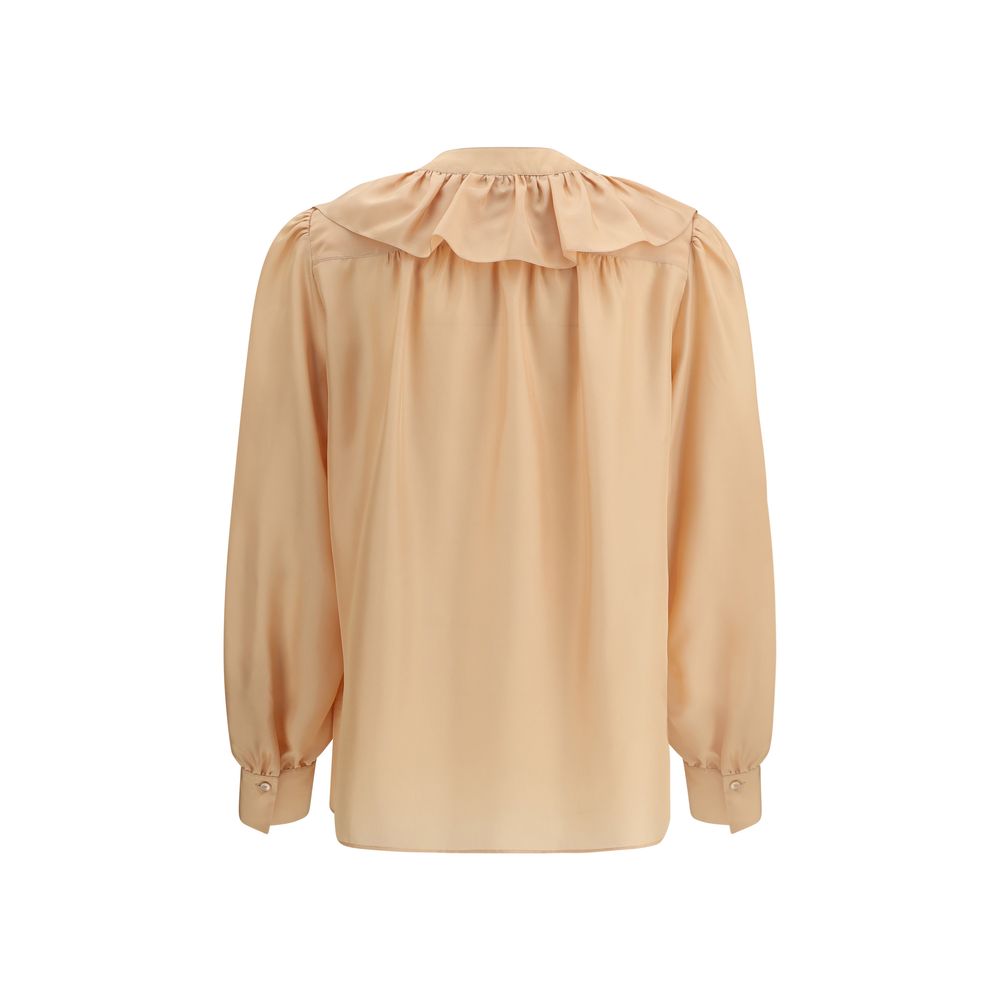 Back view of Chloé Ruffle Shirt in silk, featuring mother-of-pearl buttons and elegant ruffles.