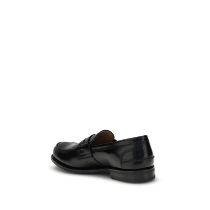 Church's Black Calf Leather Bos Taurus Slip-On Loafers with a smoked finish, showcasing lateral view and craftsmanship details.