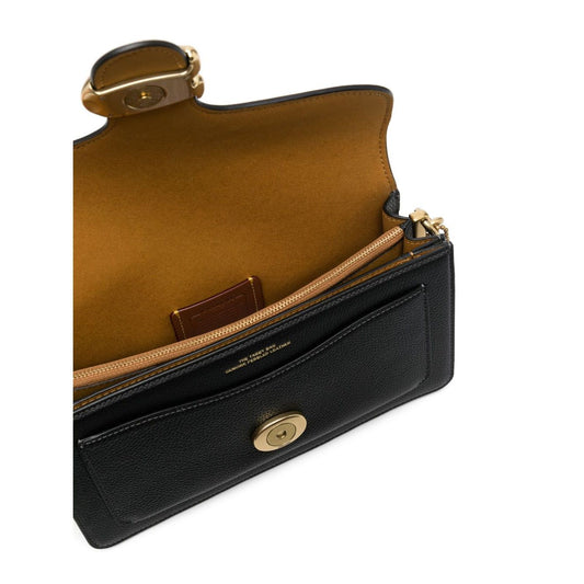 Open Coach Tabby 26 leather shoulder bag showing interior zip and leather lining.